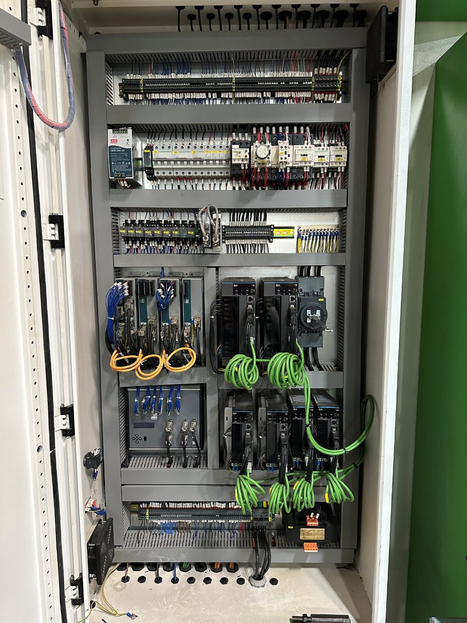 Clean Accurl Genius electrical cabinet with servo drives, breakers, and labeled wiring